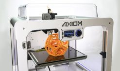 high precision 3-d printer with orange 3d model